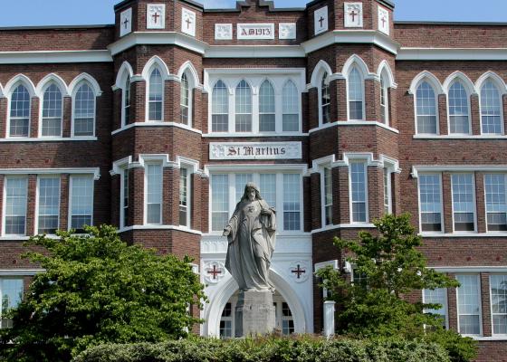 Outdoor view of college campus and statue