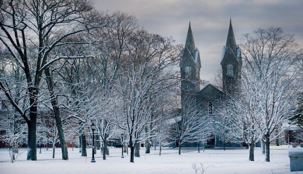 Outdoor view of college campus during winter covered in snow