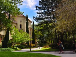 Outdoor view of college campus with students walking