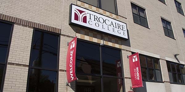 Trocaire College sign on building outdoors