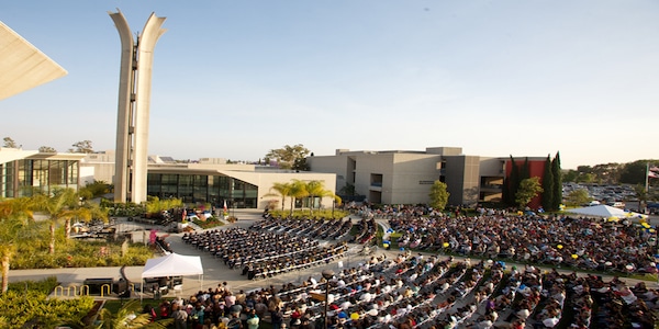 Students sitting at outdoor auditorium