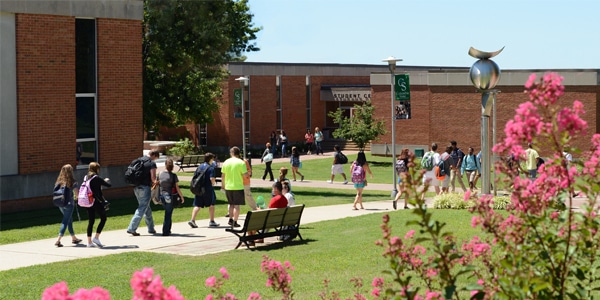 Outdoor view of college campus and students walking