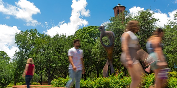 Students walking on college campus outdoors