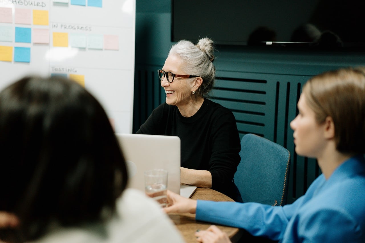 old women wearing glasses studying for class