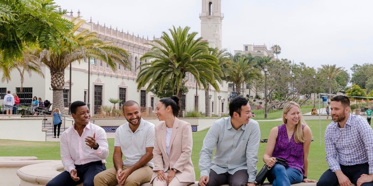 College students sitting outdoors at college campus