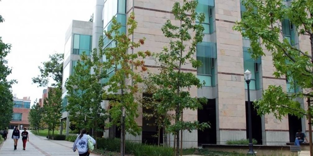 Outdoor view of college campus and students walking