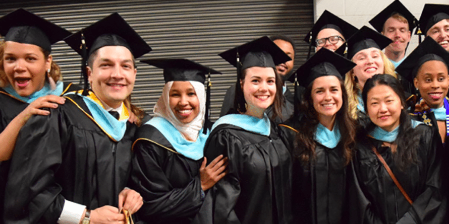 Group of smiling college graduates