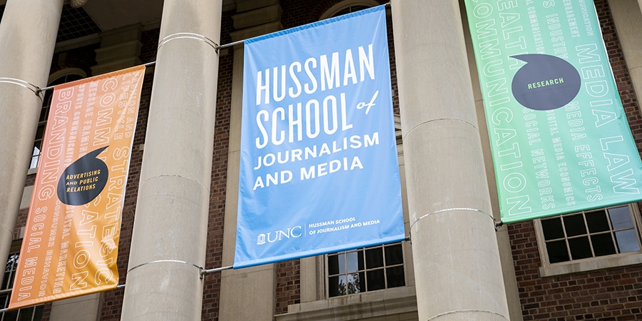 Hussman School of Journalism and Media banner and building