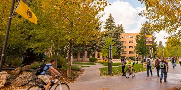 Outdoor view of college campus and students walking