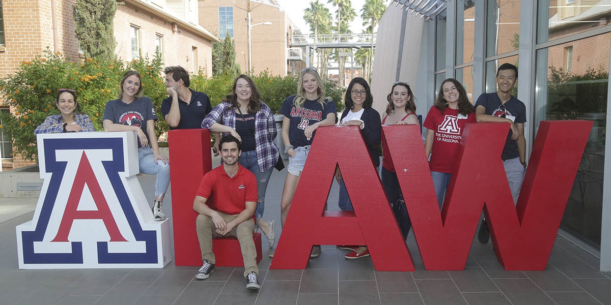 University of Arizona Law sign and college students