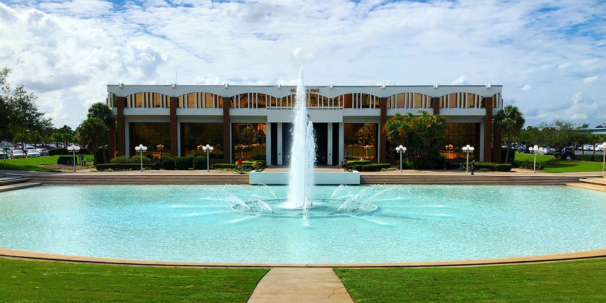 Outdoor view of college campus with pool and fountain