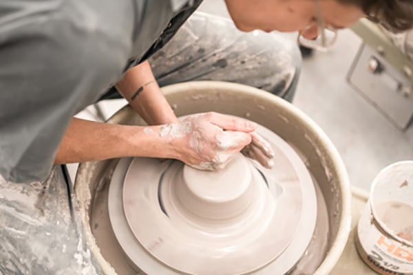 College student working with clay