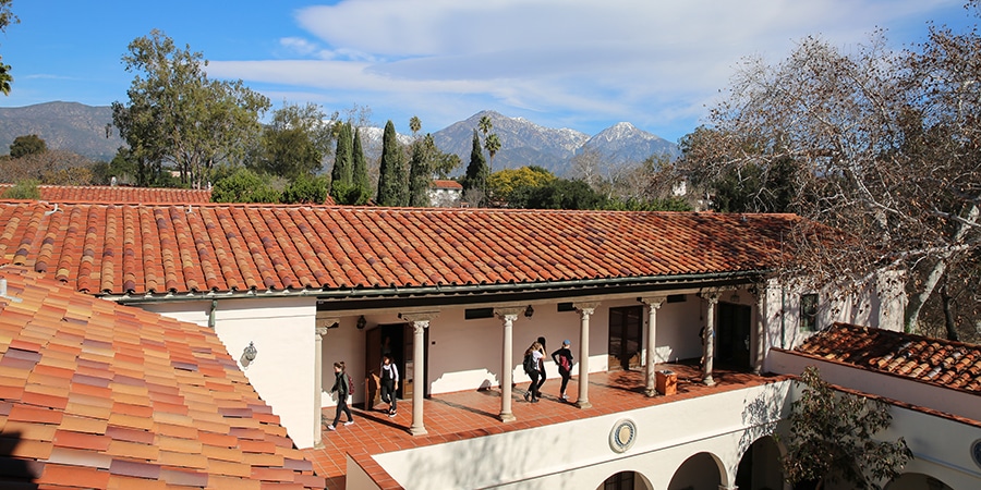 Outdoor view of college building and students