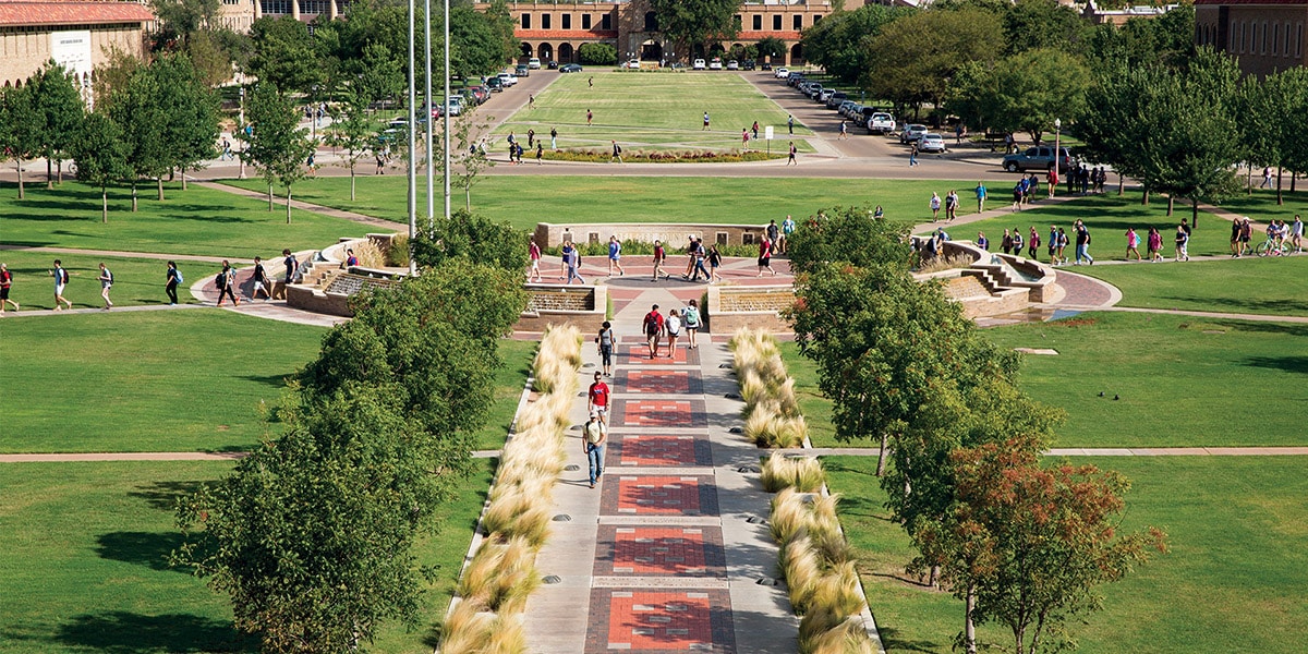 Outdoor view of college campus with students walking