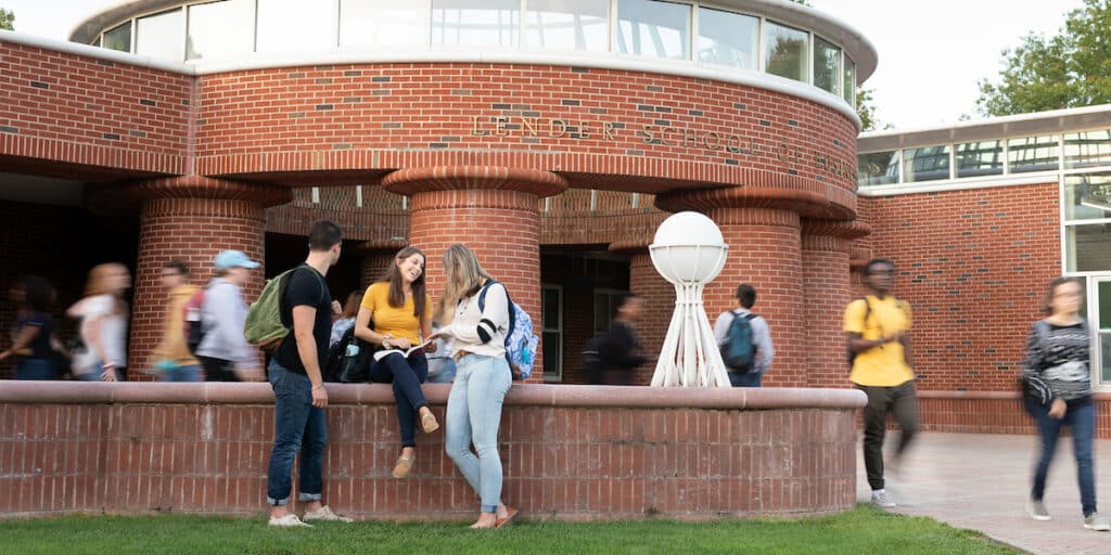 College students walking on campus outdoors