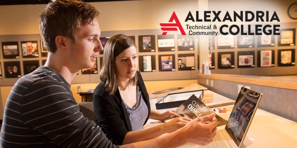Alexandria Technical Community College students working behind laptop