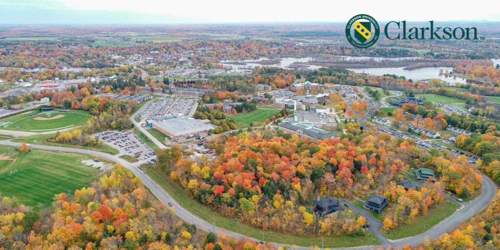 Outdoor view of college campus with Clarkson University logo