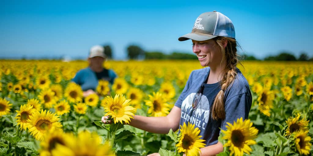 Students outdoors in sunflower field