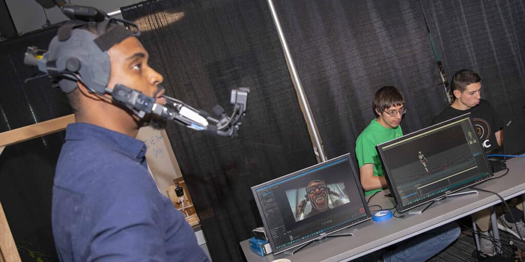 College students working in a classroom with tech gear